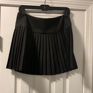 Black pleated miniskirt